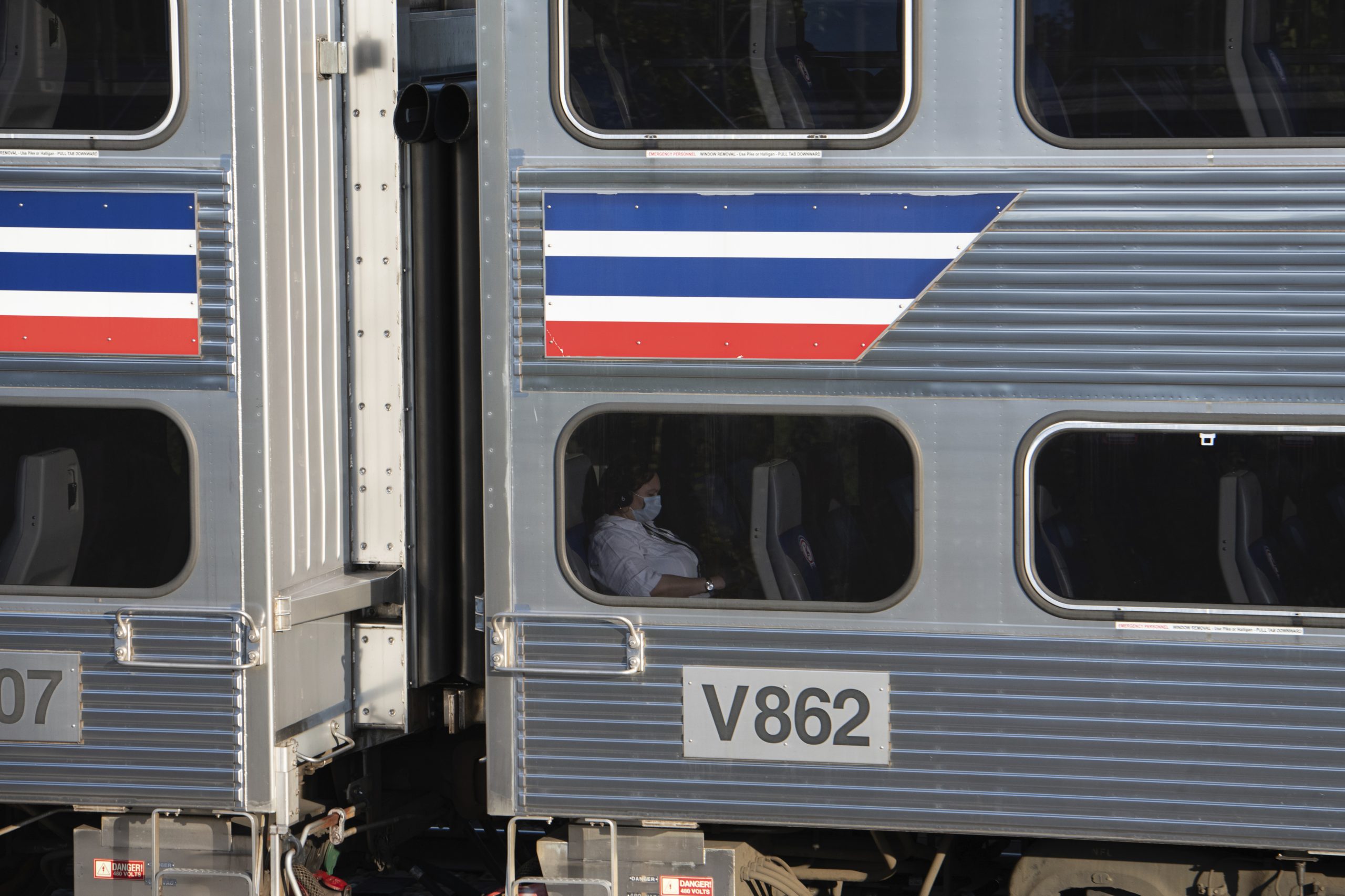 A passenger on a train near Washington, D.C., in fall 2020.