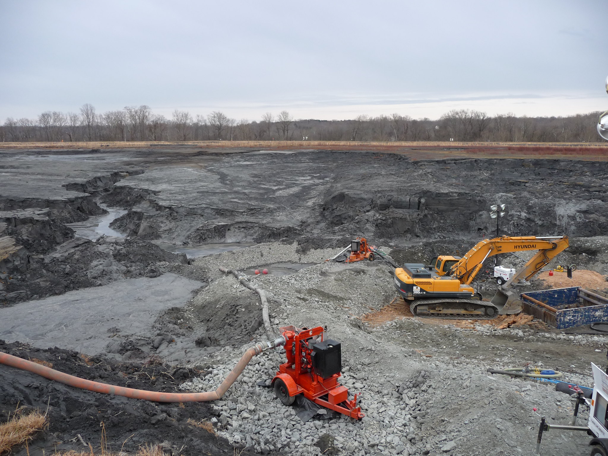 An excavator and other equipment cleaning up the Dan River coal ash spill in North Carolina in 2014.